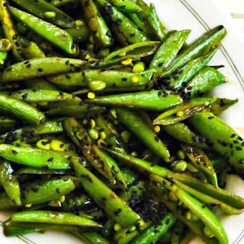 Spicy Stir-Fried Sugar Snap Peas close-up photo of finished dish on plate