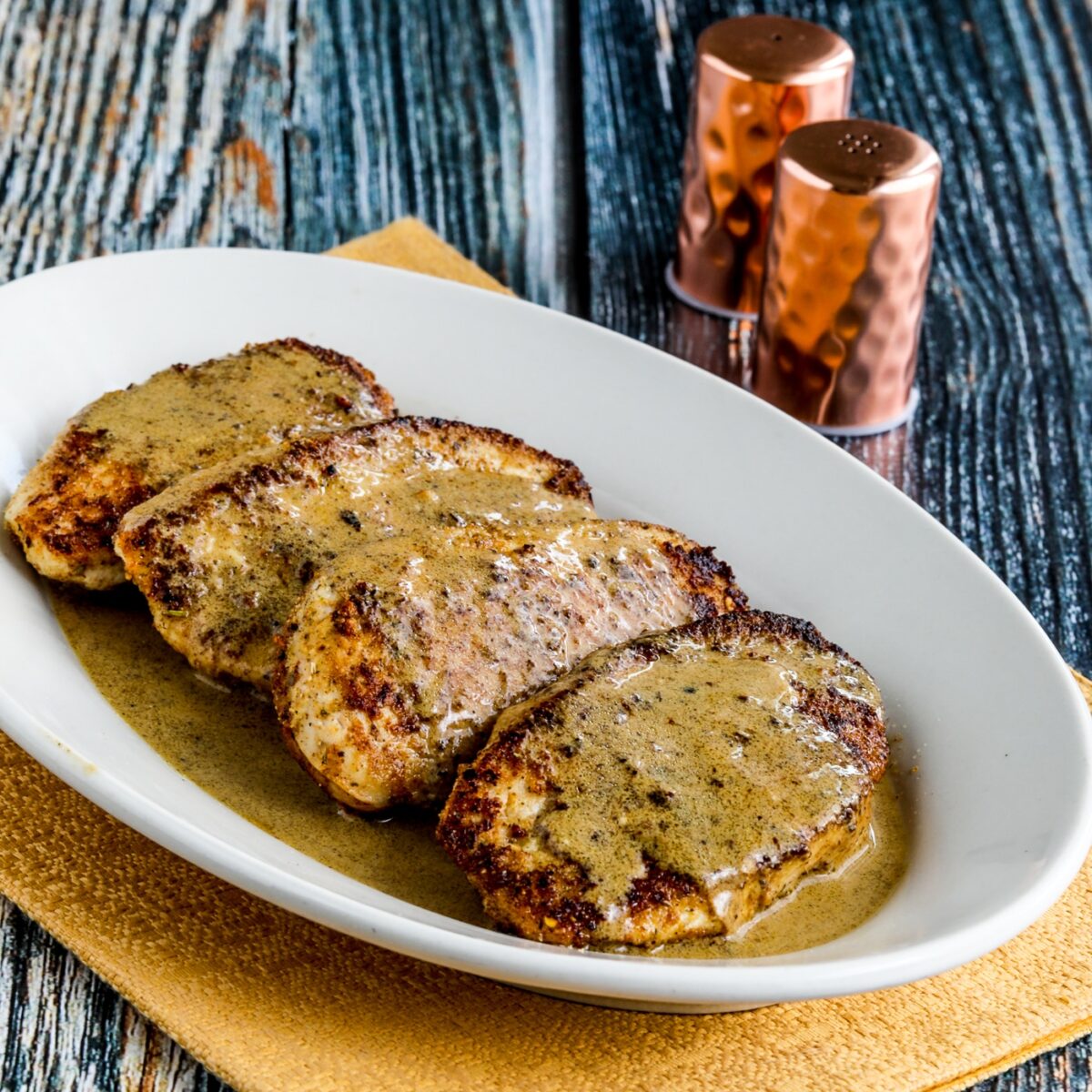 Chicken Cutlets with Mustard Sauce square thumbnail image of chicken on serving plate