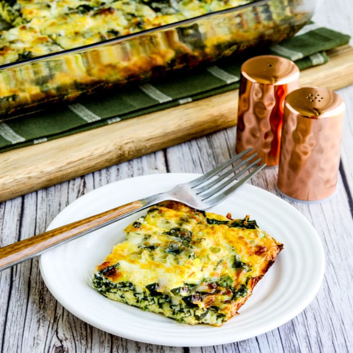 thumbnail image of Kale, Mozzarella, and Egg Bake, one slice on plate and casserole dish in background
