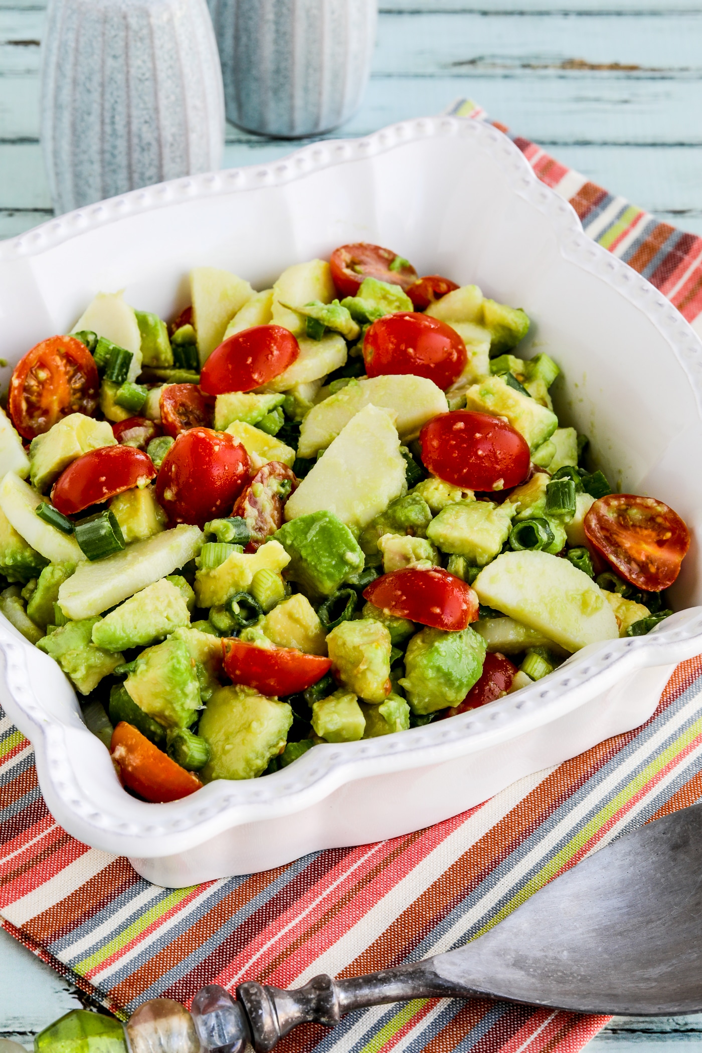 Heart of Palm Salad with Tomato and Avocado close-up photo of finished salad in serving bowl