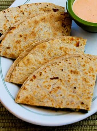 Kale Quesadillas shown on serving plate with Sriracha-Ranch Dipping Sauce