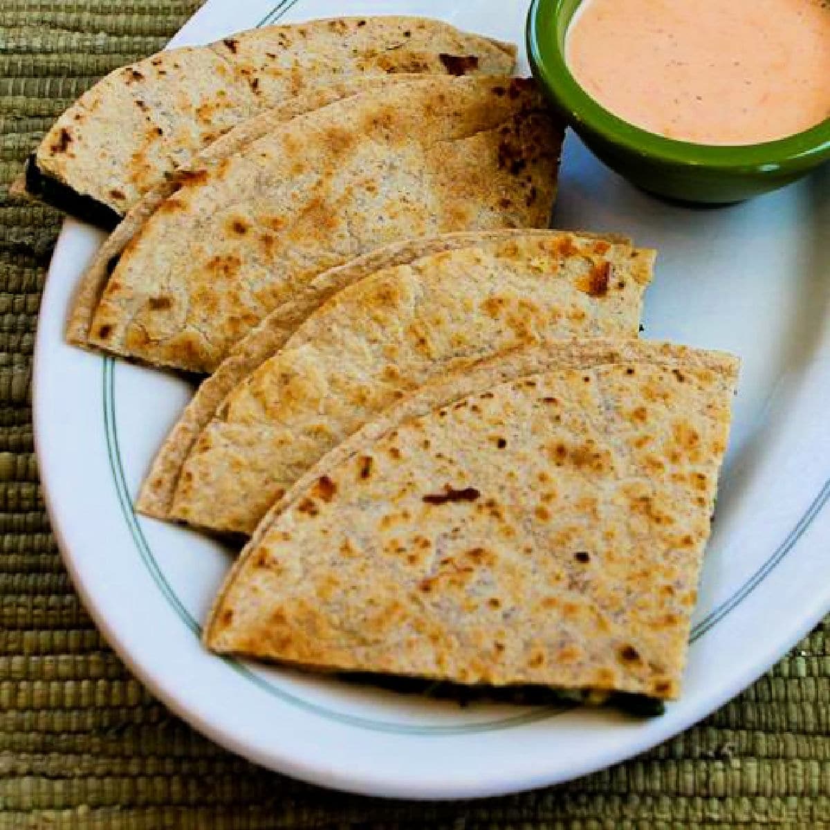 Kale Quesadillas shown on serving plate with Sriracha-Ranch Dipping Sauce