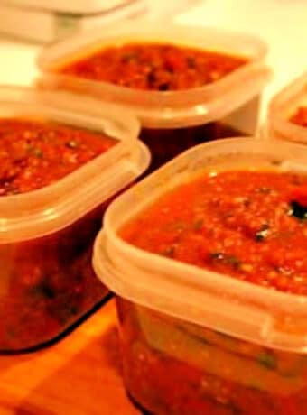 Italian Sausage Marinara Sauce shown in freezer containers.