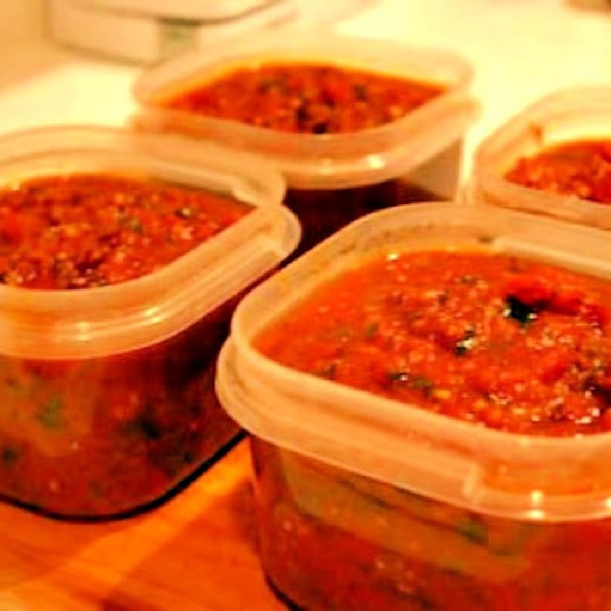 Sausage Marinara Sauce shown in freezer containers.