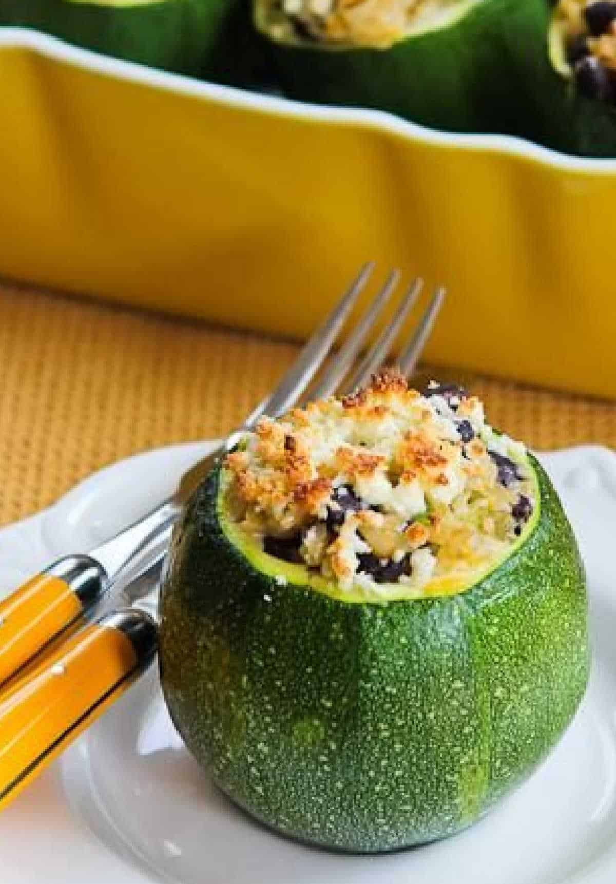 Vegetable stuffed zucchini close up on a serving plate