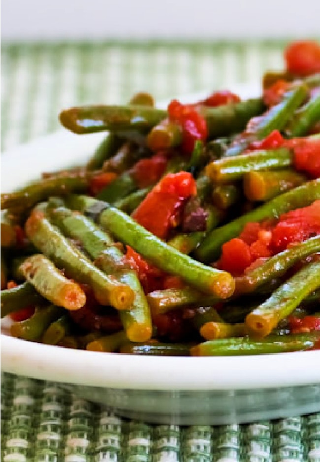 Cropped image of Green Beans with Tomatoes on serving plate.