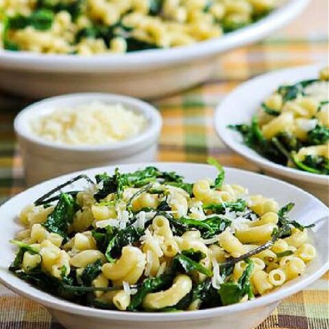 Lemon Parmesan Pasta with Greens shown in two serving dishes with larger bowl in back