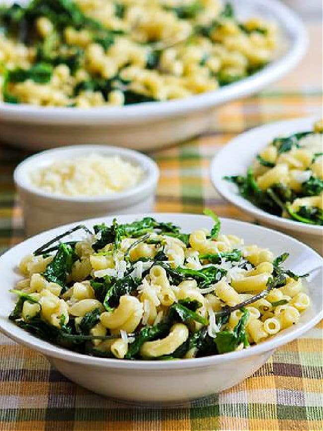 Lemon Parmesan Pasta with Greens shown in two serving bowls.