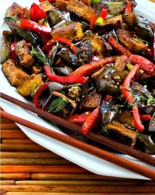 Stir-Fried Tofu with Eggplant on serving plate with chopsticks