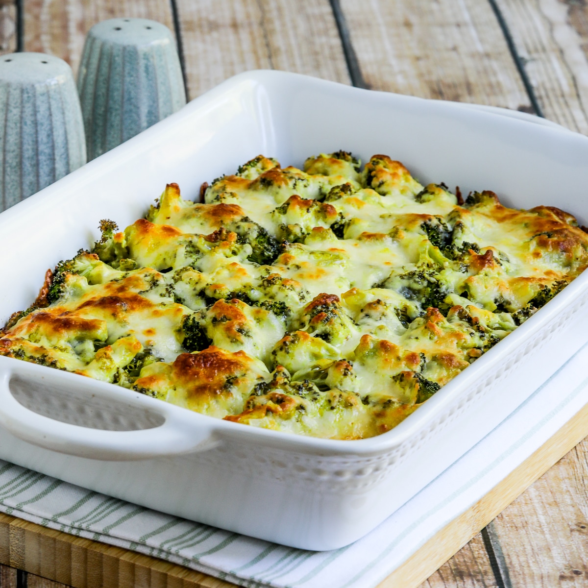 Square image of Broccoli Cauliflower Rice Casserole shown in baking dish.