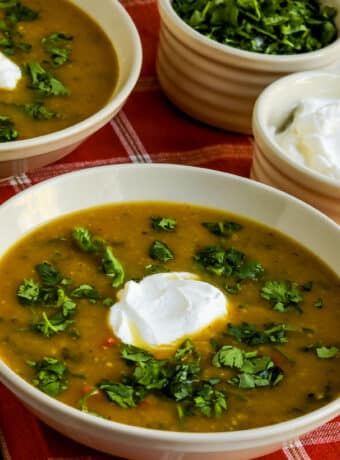 Square image for Butternut Squash and Black Bean Soup shown in two bowls.