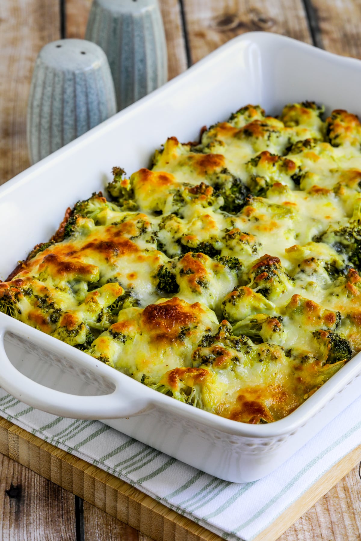 Broccoli and Rice Casserole shown in baking dish with melted cheese.