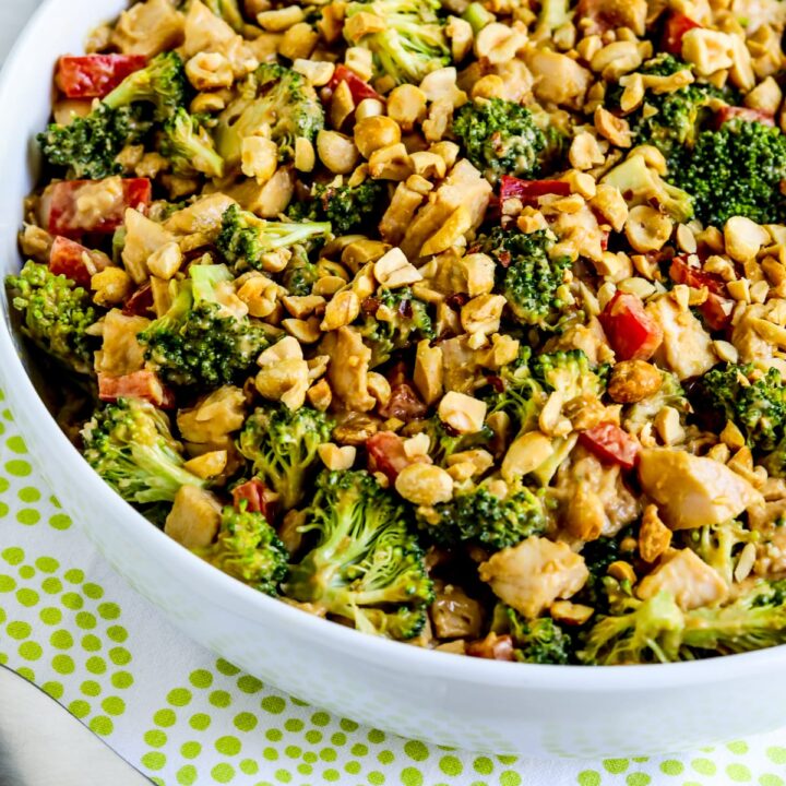 Chicken Broccoli Salad shown in serving bowl with spoon.