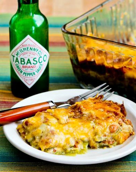 Vegetarian Mexican Casserole with one serving on plate and baking dish in the back