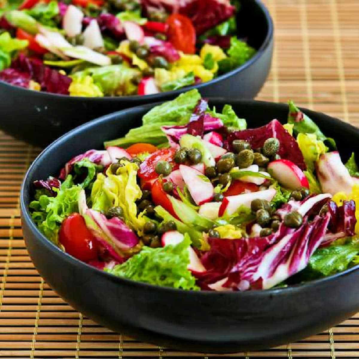 Ottolenghi's Perfect Lettuce Salad shown in two black bowls.