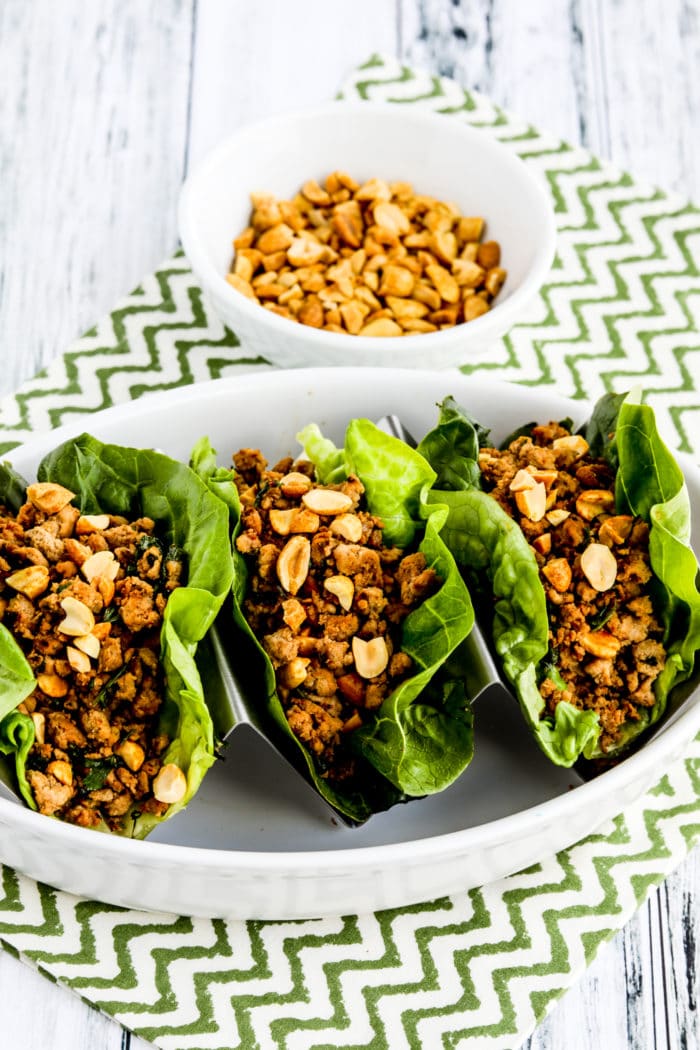 close-up photo of Asian Lettuce Cups with Spicy Ground Turkey, finished lettuce cups with peanuts