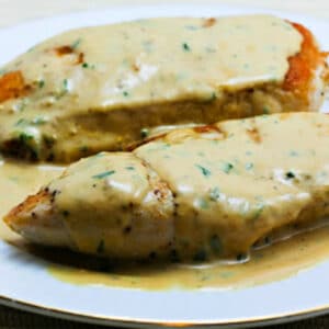 Sauteed Chicken Breasts with Tarragon-Mustard Pan Sauce shown on serving plate.