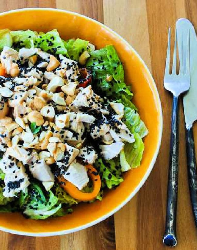 Cropped image for Asian Chopped Chicken Salad shown in serving bowl with knife and fork.