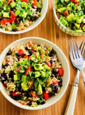 Slow Cooker Mexican Rice Bowls shown in one large bowl and two smaller serving bowls.