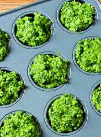 Kale Pesto with Basil shown in muffin tin to be frozen.