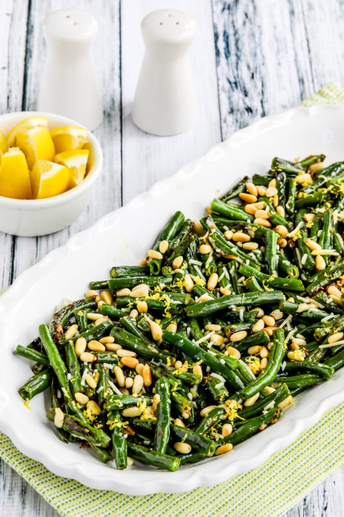 Green Beans with Lemon, Parmesan, and Pine Nuts close-up photo of finished beans on serving plate