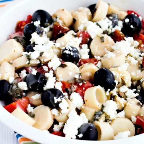 Tomato Salad with Hearts of Palm, Olives, and Feta close-up photo