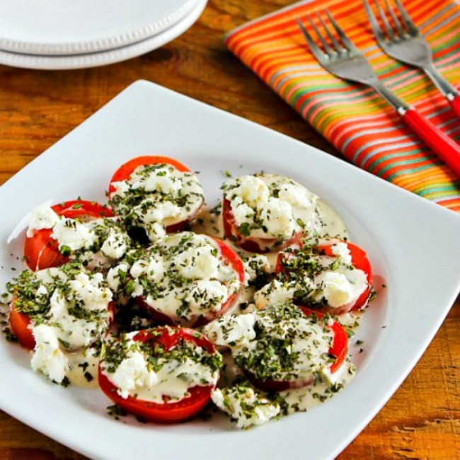 Summer Tomato Salad with Goat Cheese, Basil Vinaigrette, and Herbs thumbnail image of finished salad on plate