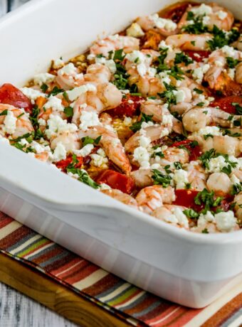 Roasted Tomatoes and Shrimp with Feta close-up square image of finished recipe in baking dish