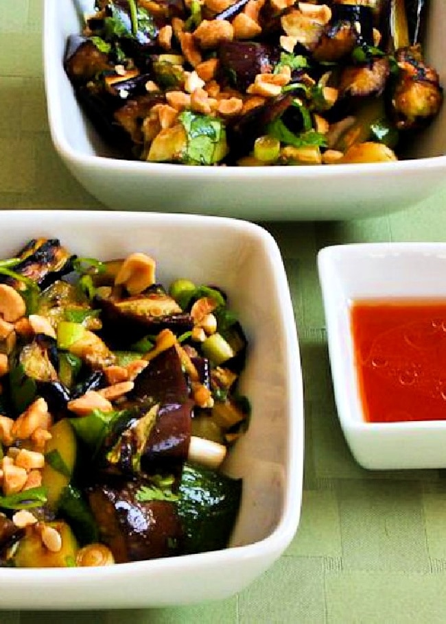 Cropped image of Thai Eggplant and Zucchini Salad shown in two serving bowls.