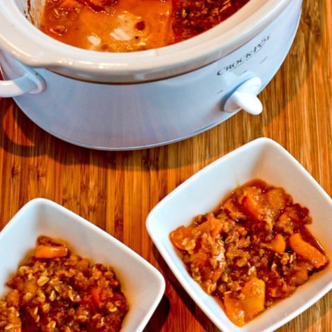 Slow Cooker Peach Crisp finished peach crisp in slow cooker and in two bowls