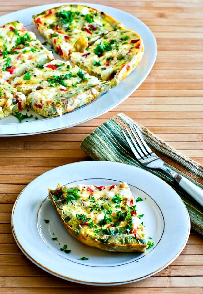 Slow Cooker Breakfast Casserole with Artichokes, Red Pepper, and Feta finished casserole plus serving on plate