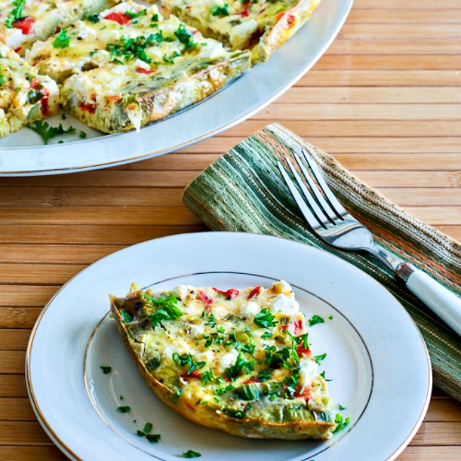 Slow Cooker Frittata with Artichoke Hearts, Red Pepper, and Feta thumbnail image of frittata served on plate