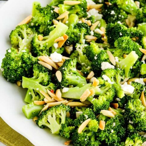 Stir together the broccoli, feta, and half the almonds and toss with the dressing.  Serve salad right away, sprinkling the rest of the almonds on top.