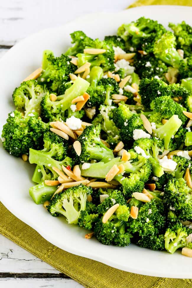 Stir together the broccoli, feta, and half the almonds and toss with the dressing.  Serve salad right away, sprinkling the rest of the almonds on top.