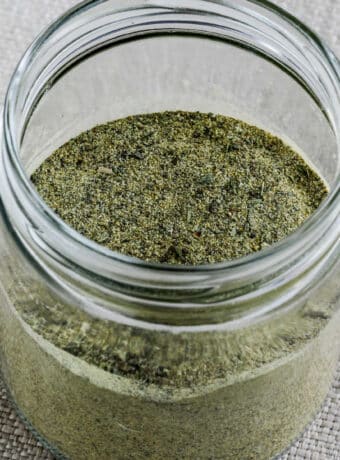 Square image of Kalyn's Herb Blend Recipe shown in glass jar with lid open.