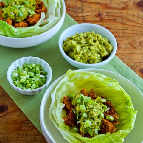 Slow Cooker Barbecue Chicken shown in lettuce cups with Guacamole