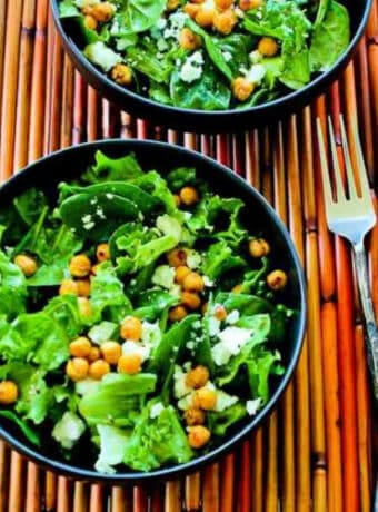 Green Salad with Chickpeas and Feta shown in two bowls with forks.