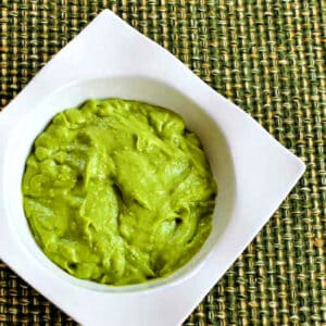 Square image for Easy Avocado Sauce in white serving bowl.