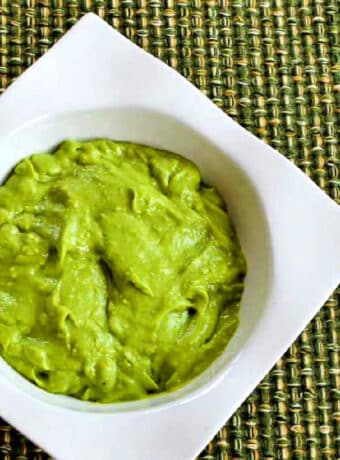 Square image for Easy Avocado Sauce in white serving bowl.