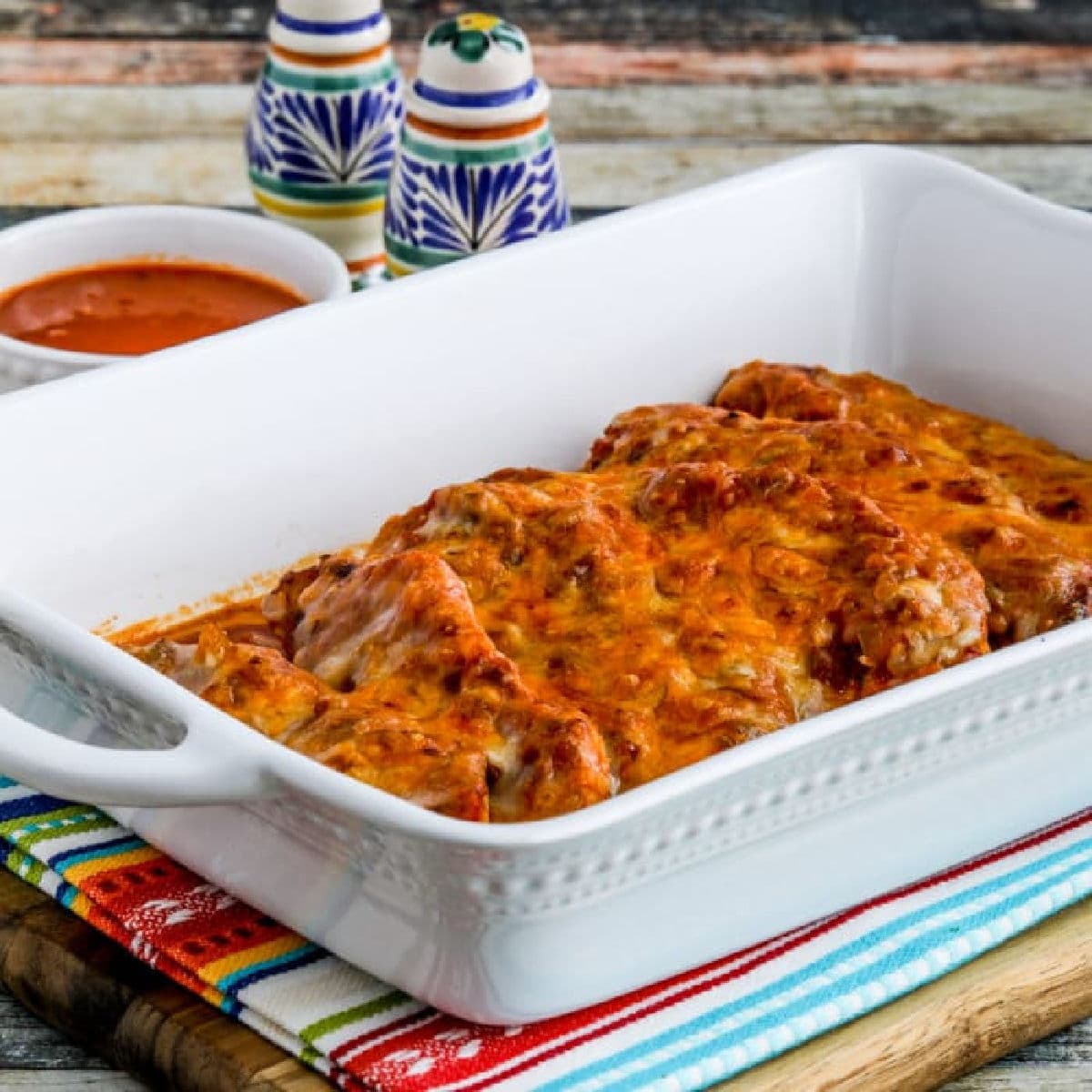 Square image for Slow Cooker Salsa Pork Chops shown in baking dish.