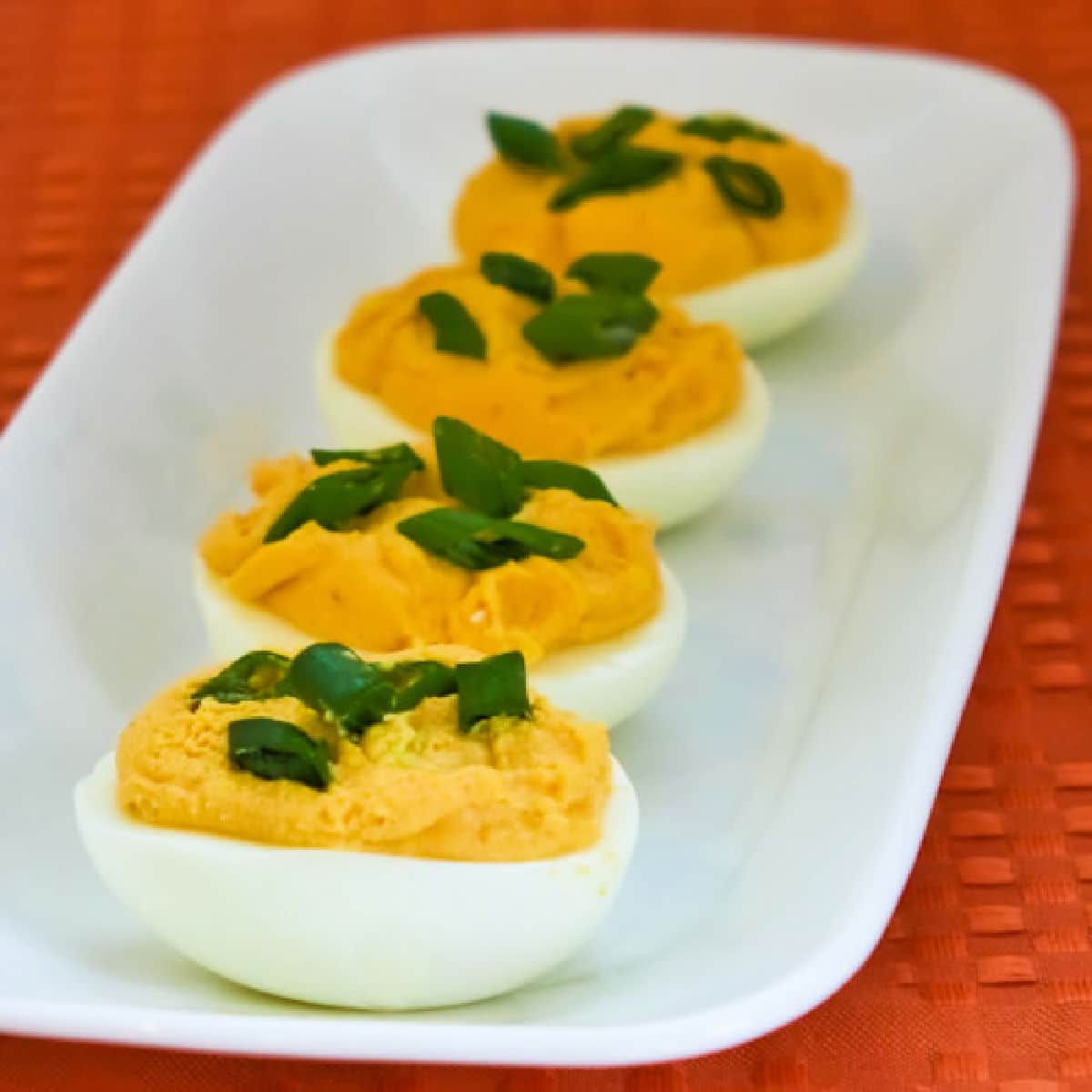 Sriracha Deviled Eggs shown on serving plate