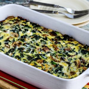 Kale, Mushroom, and Cheese Breakfast Casserole square photo of finished casserole in baking dish.