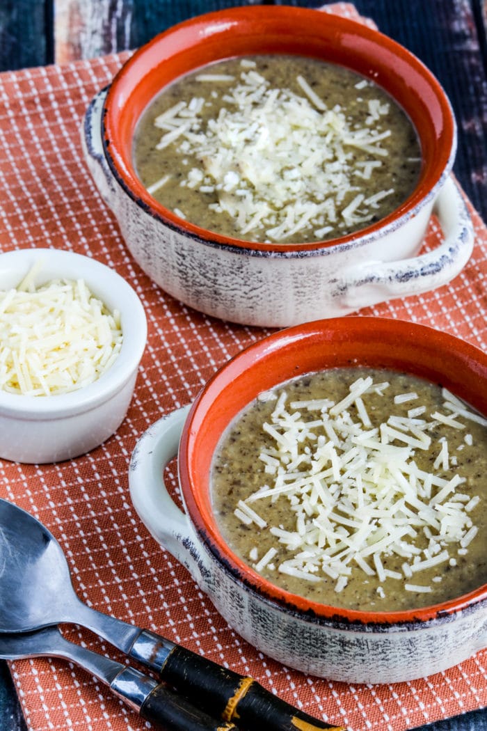 Instant Pot Cauliflower Mushroom Soup in two soup bowls with Parmesan cheese, close-up photo