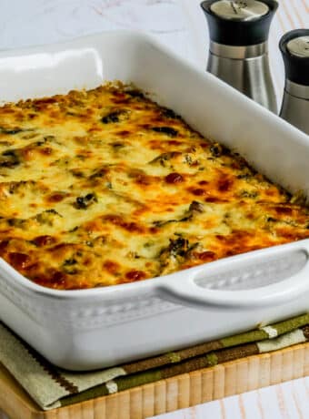 Square image for Cheesy Vegetarian Casserole (with Cauliflower Rice) shown in baking dish with salt and pepper on the side.