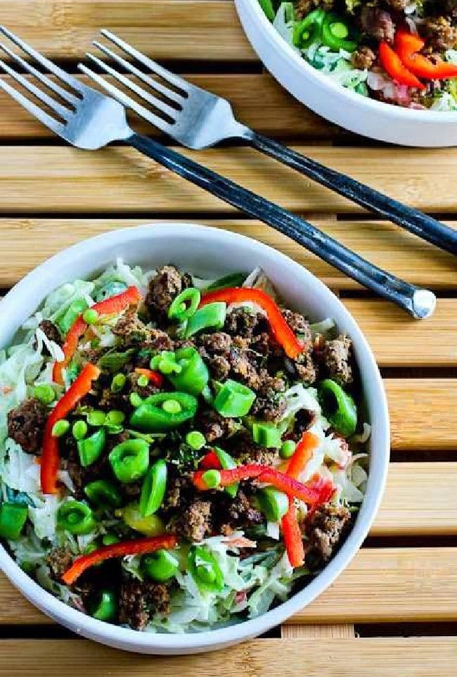 Cropped image for Sriracha Beef Cabbage Bowls showing it in two bowls with forks.