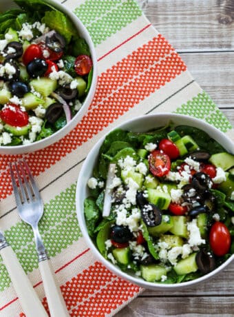 Kale Greek Salad square image in two serving bowls