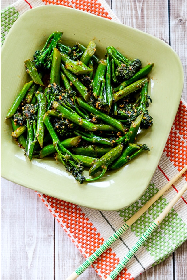 Stir-Fried Broccolini on serving plate with chopsticks on the side