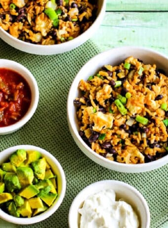 CrockPot Rice and Bean Bowl shown in two serving bowls with toppings.