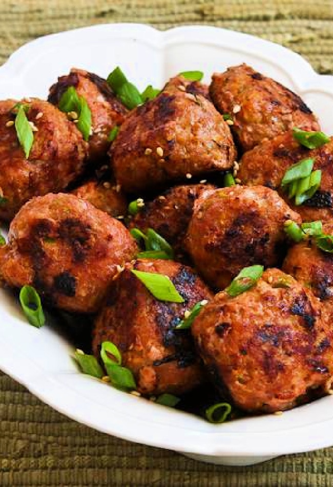 Cropped image of Grilled Sriracha Turkey Meatballs shown on serving plate.