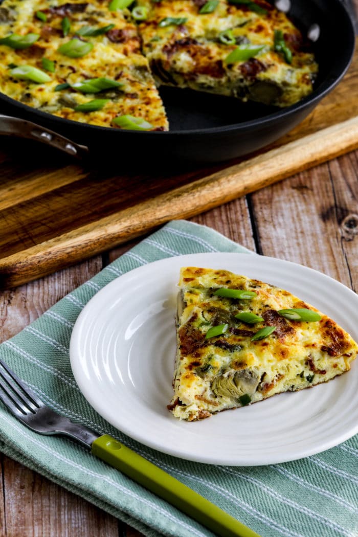 Artichoke Frittata with Bacon on serving plate with frittata in background in pan